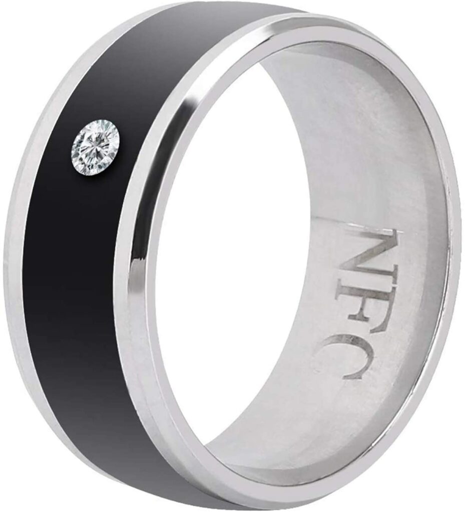 A black and silver NFC ring with a small stone.