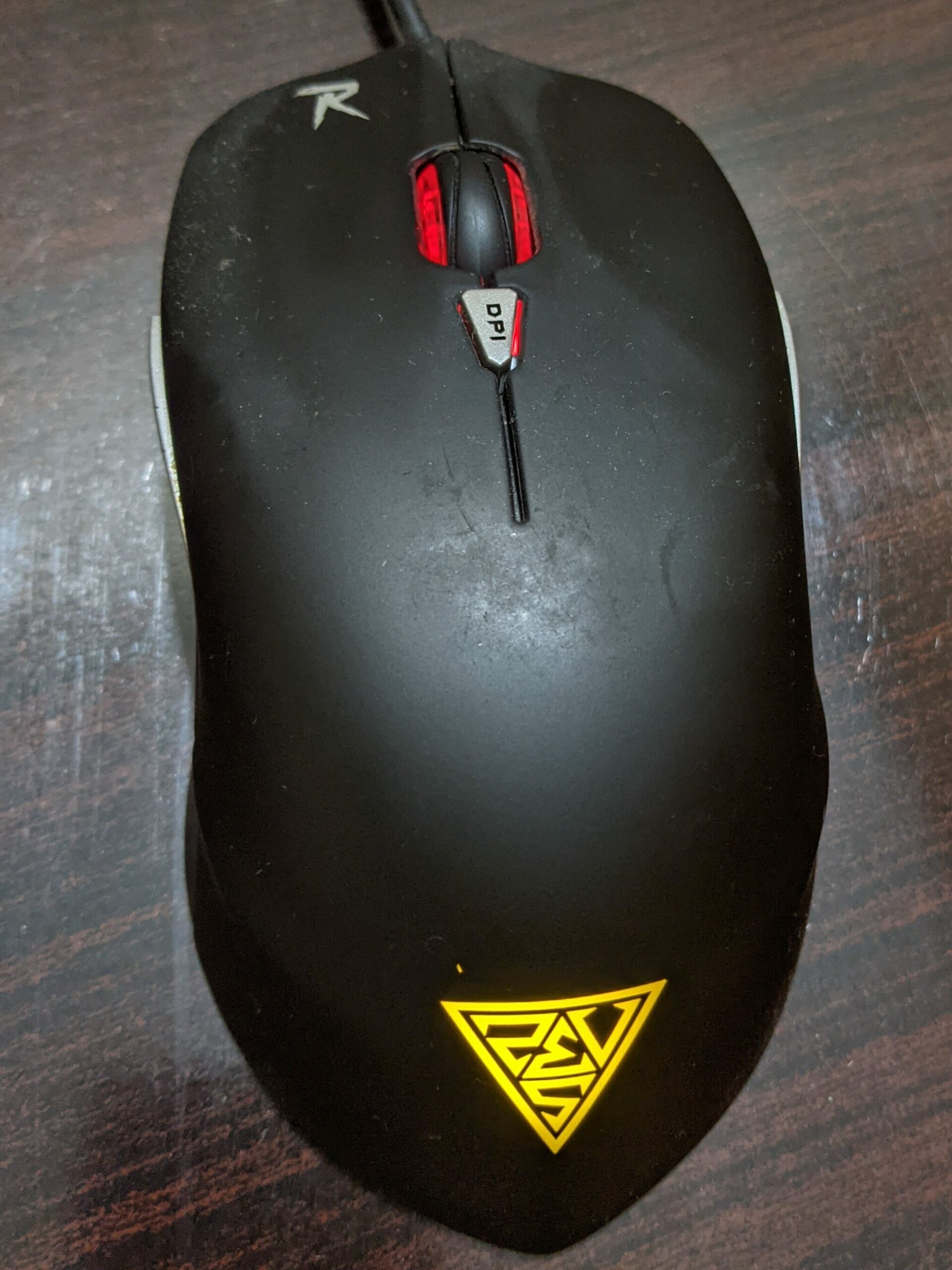Gamdias Ourea E1 with multiple colors and yellow logo on the back. It has a rubberized material.