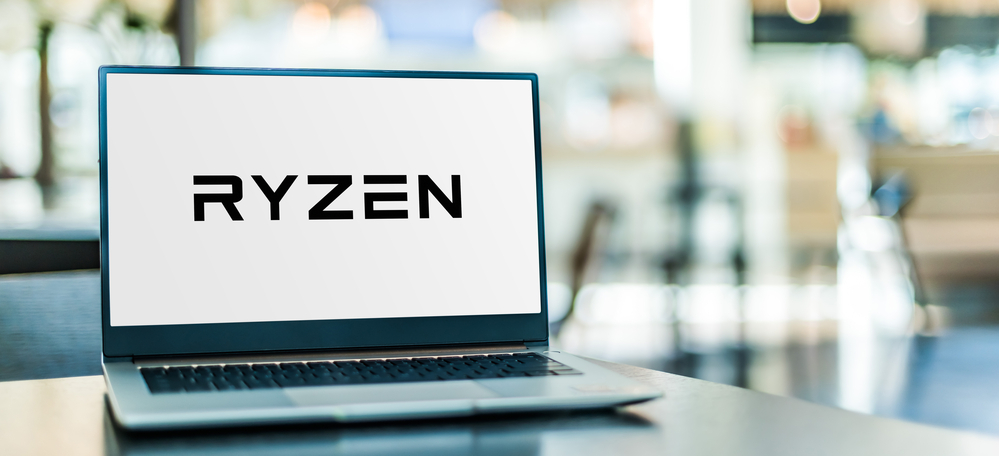 Laptop computer displaying logo of Ryzen, a brand of x86-64 microprocessors designed and marketed by Advanced Micro Devices (AMD)