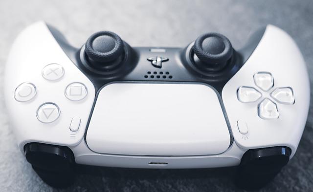 White PS5 controller lying on a carpet